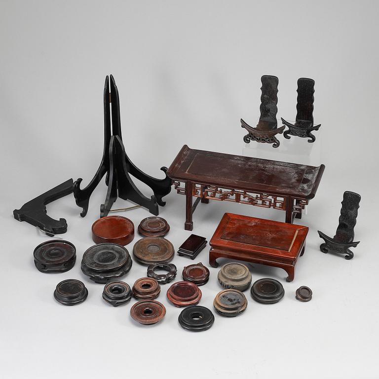 A group of Chinese wooden stands, 20th Century. (20 pieces).