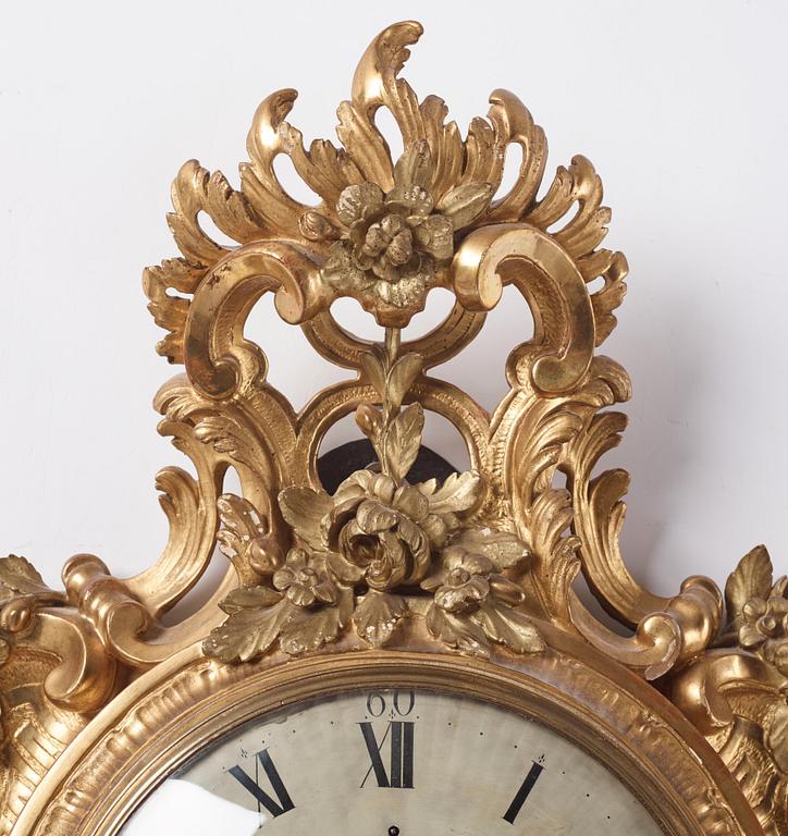 A rococo giltwood cartel clock by J. Lindgren (master in Stockholm 1761-62).