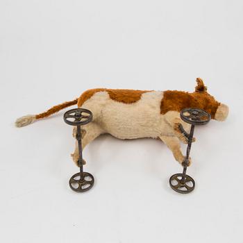 A Steiff cow and a Schuco "Tricky", Germany, 1910 and 1930/40s.