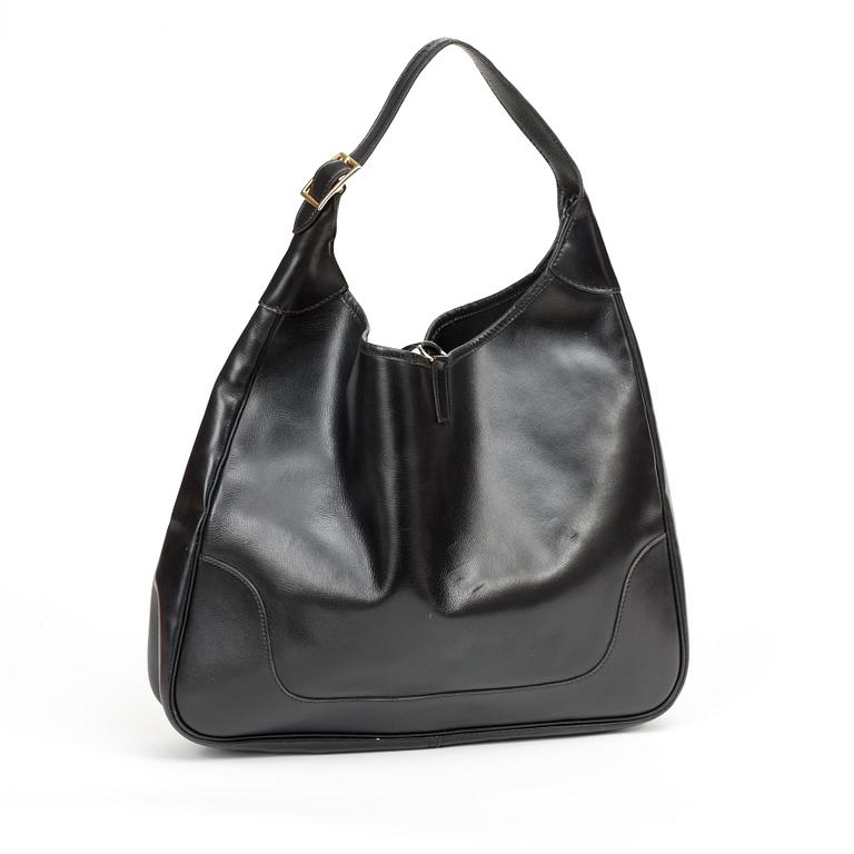 A 1970s black leather handbag "Trim Bag" by Hermès.