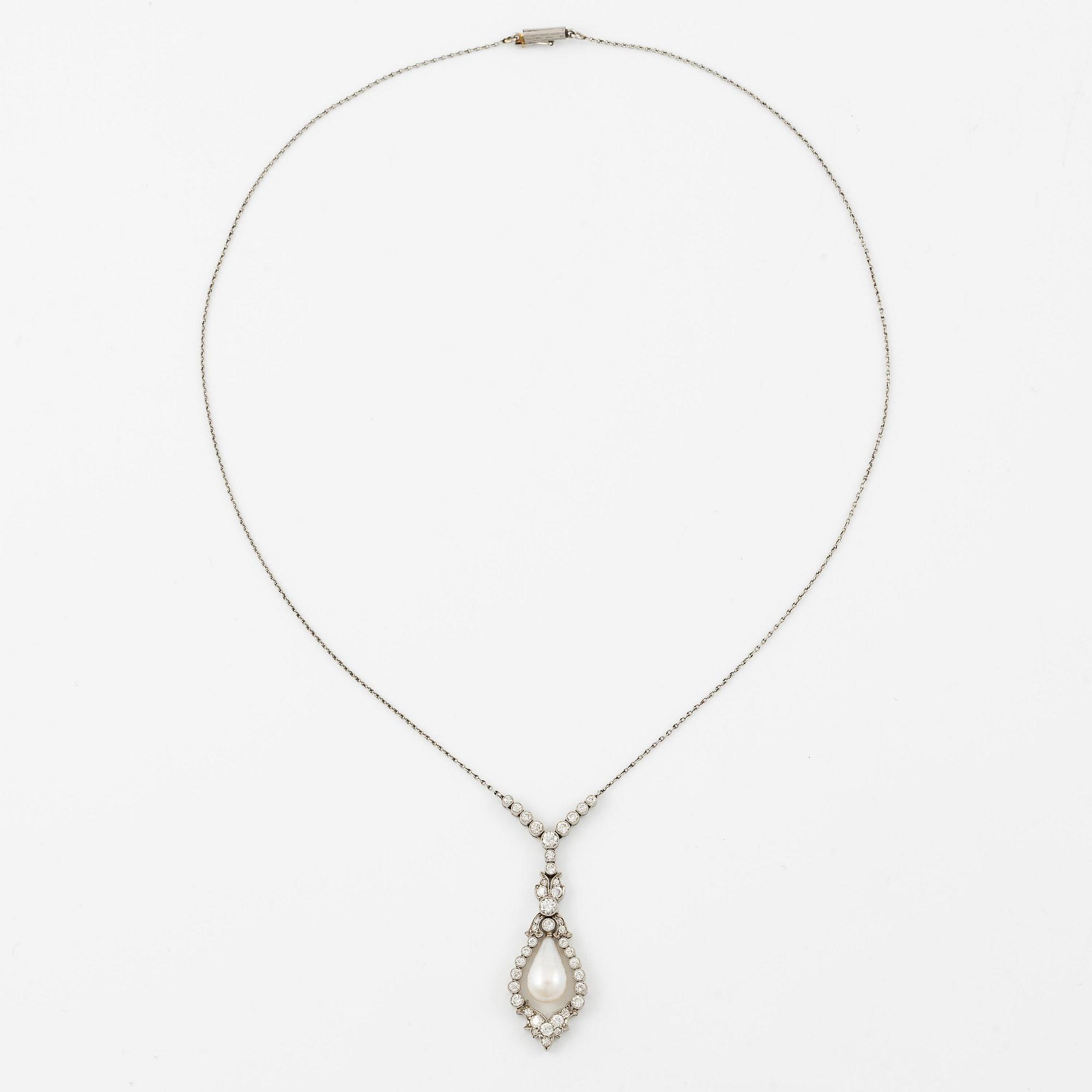 A platinum necklace with a drop-shaped pearl.