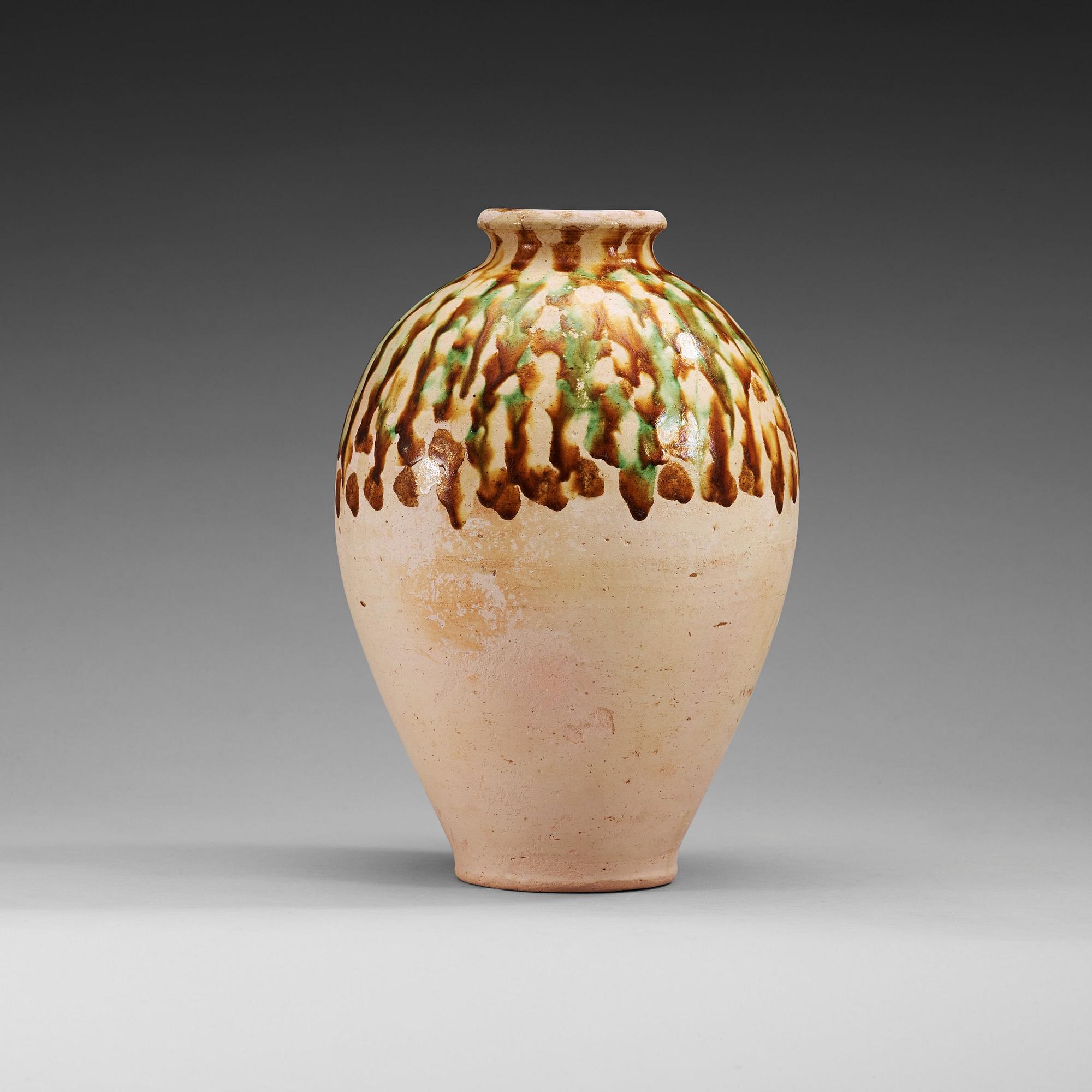 A Sancai-glazed pottery jar, Tang Dynasty (618-907).