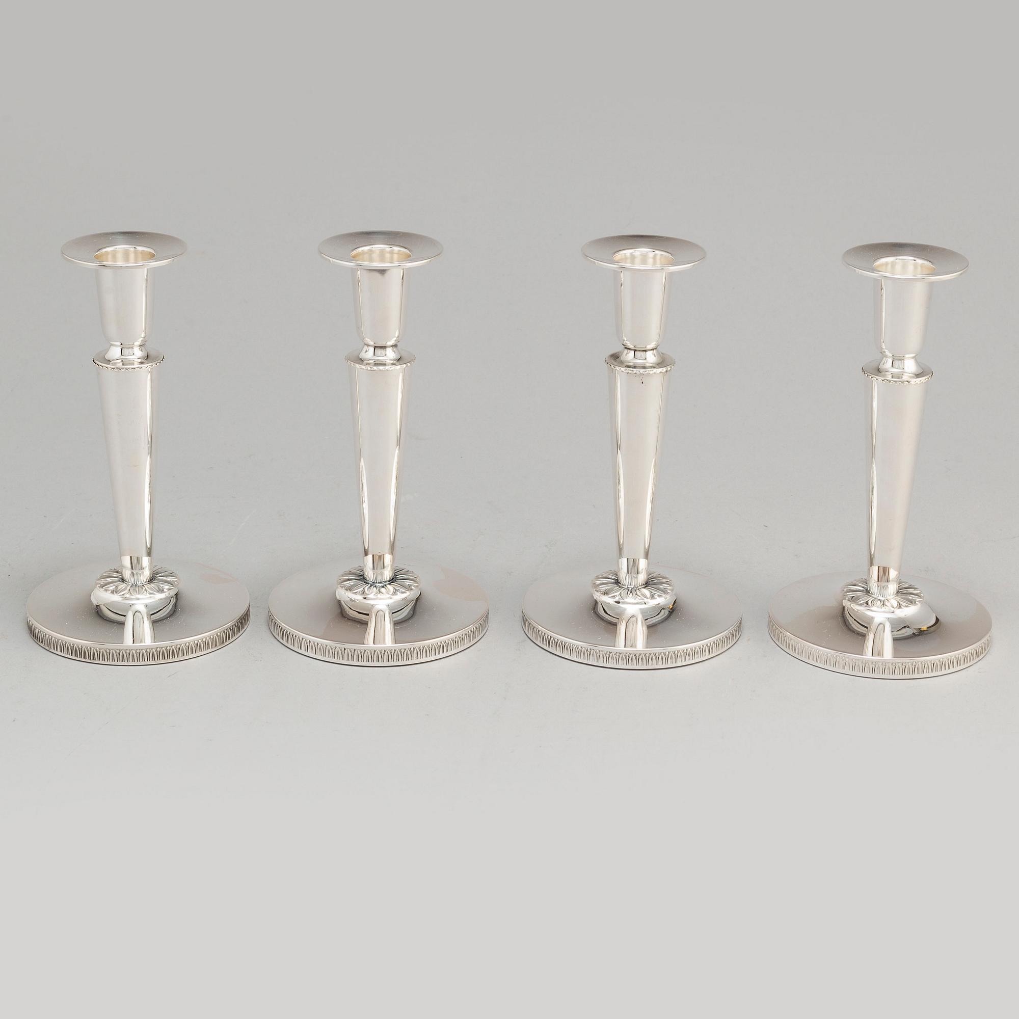 a set of four silver candlesticks by Ceson Gothenburg 1985-1987.