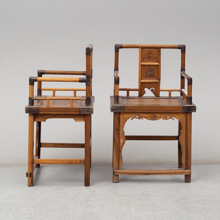 A pair of Chinese wooden armchairs, late 19th/early 20th century.