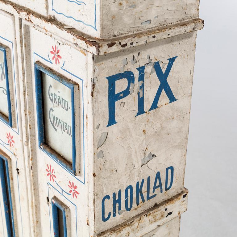 A circa turn of the century candy dispenser.