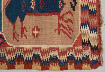 CARRIAGE CUSHION. "Bäckahästen". Double-interlocked tapestry. 48 x 99 cm. Scania, Sweden, around 1800.