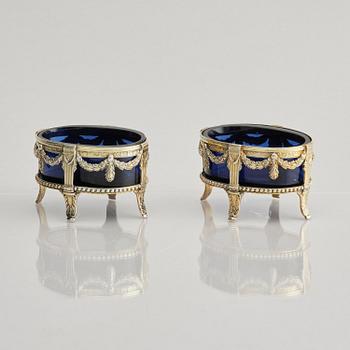 A pair of Swedish 18th century silver and blue glass salt cellars, mark of Pehr Zethelius, Stockholm 1775.