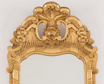 An early 20th century rococo style mirror.