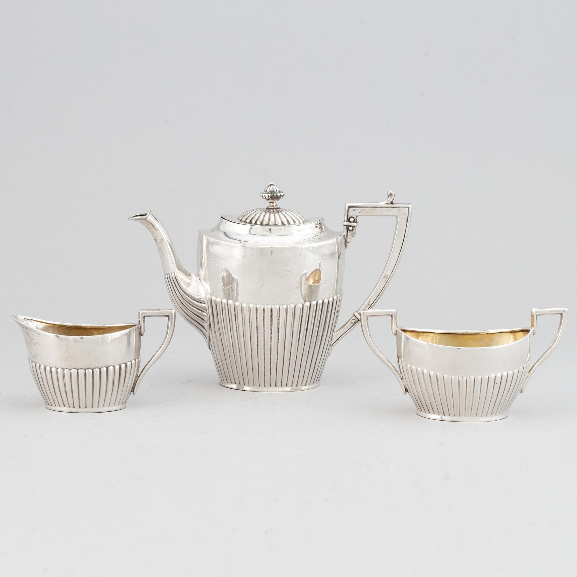 A silver mocha pot, creamer and sugar bowl, swedish import mark of NL Dahlström & Co, Örebro 1930.