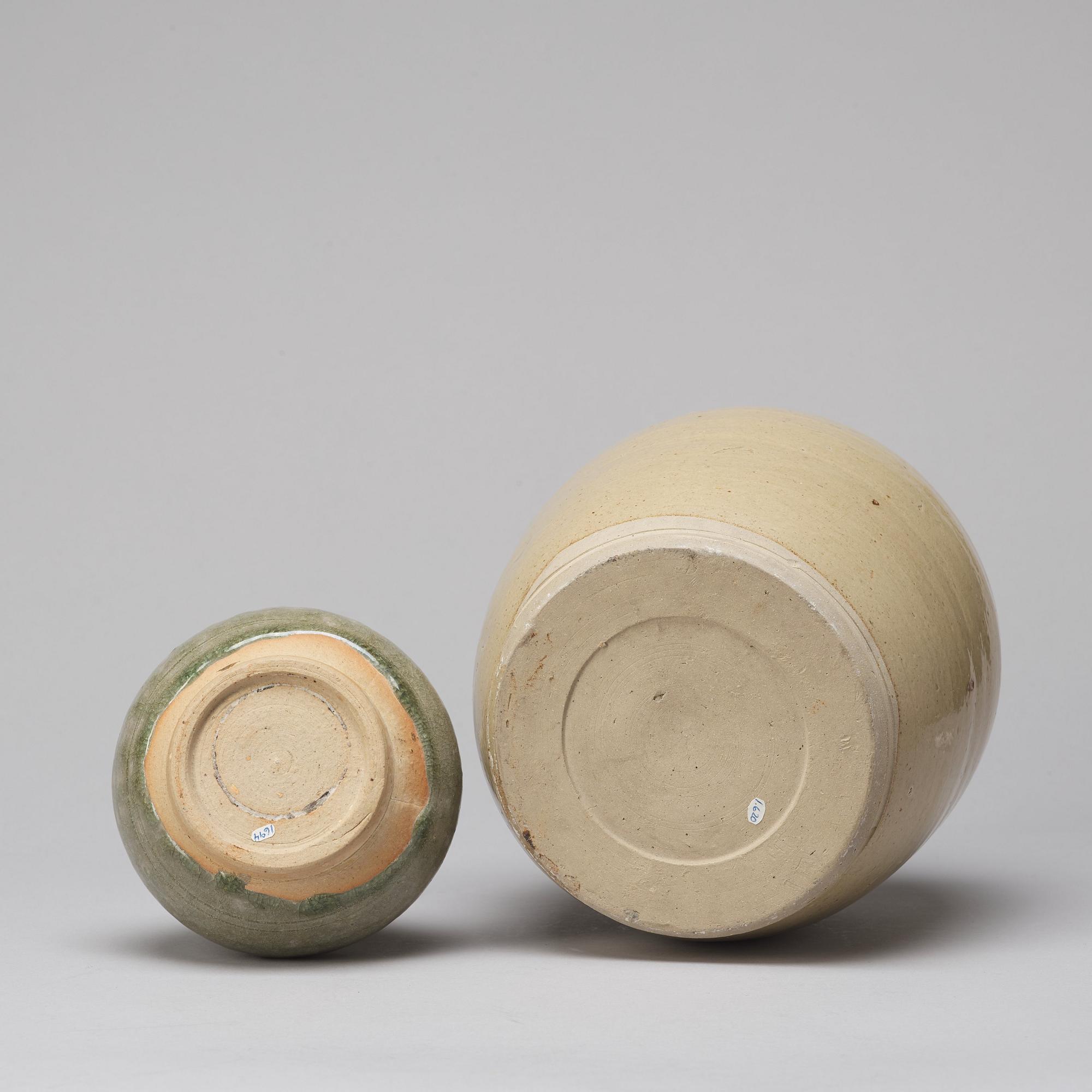 A celadon glazed jar with cover and a vase, South East Asia, 16/17th Century.