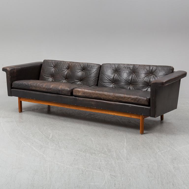 A black leather 1960s-70s sofa by Karl Erik Ekselius.