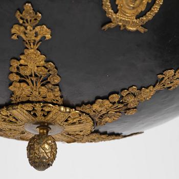 A presumably Russian Empire gilt and patinated bronze nine-branch chandelier, 19th century.