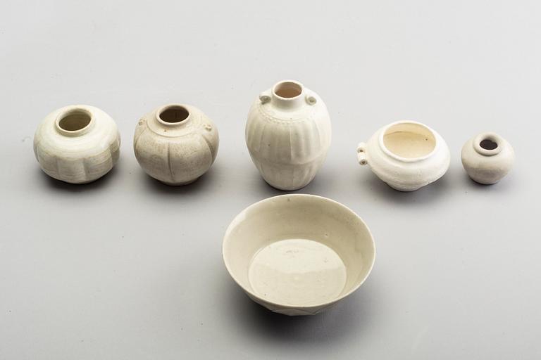 A group of white glazed South East Asian vases and bowls, partly 16/17th Century.