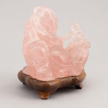 A rose quartz figure of buddai, China, 20th Century.