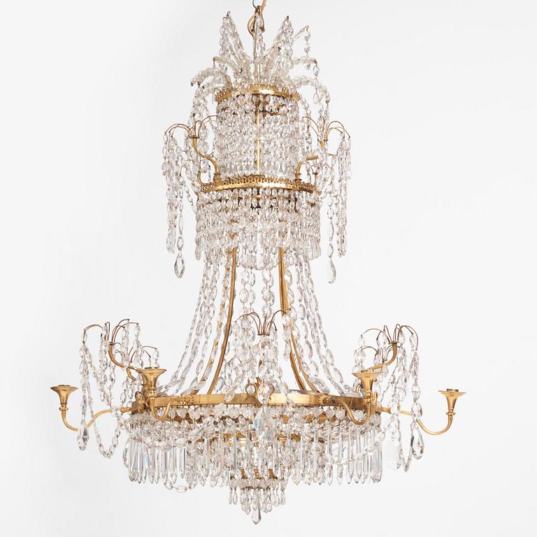 A German Louis XVI gilt-brass and cut-glass six-light chandelier, late 18th century.