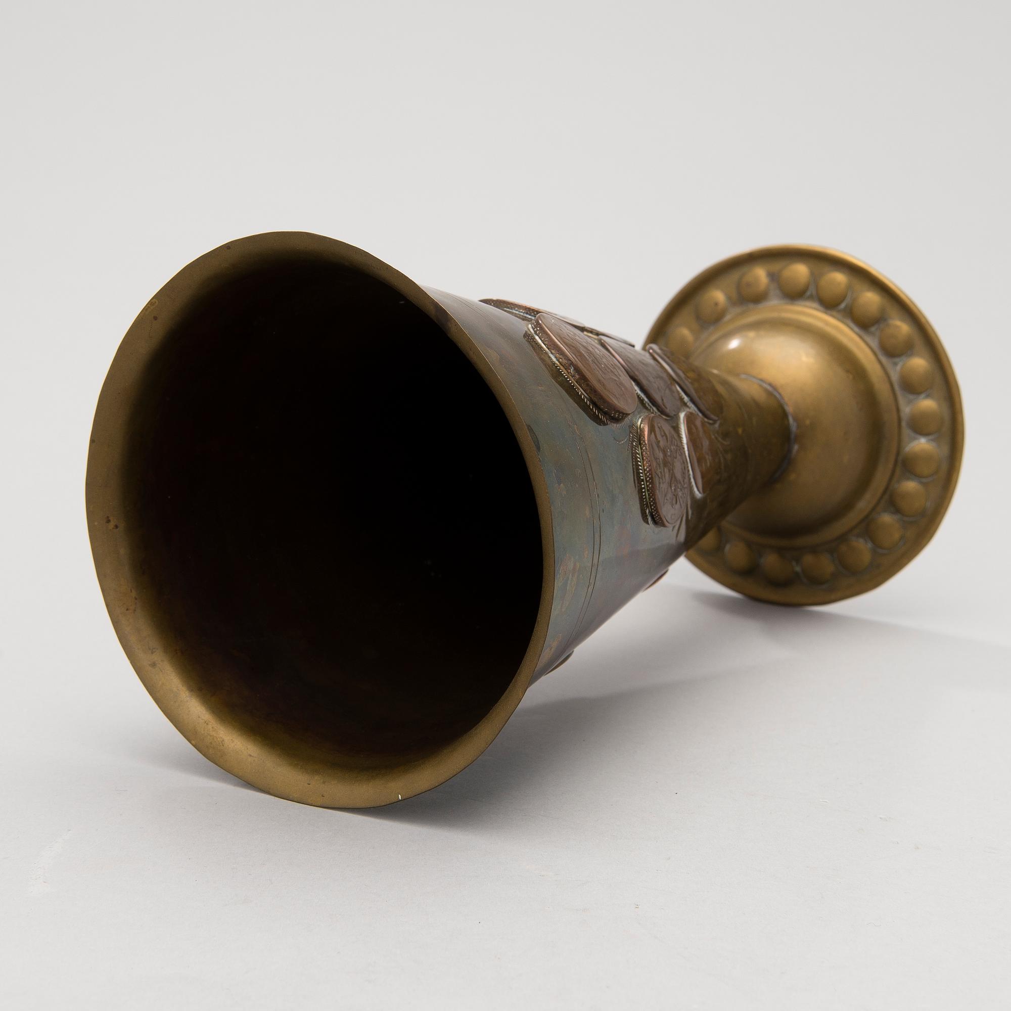 A late 19th Century brass cup.