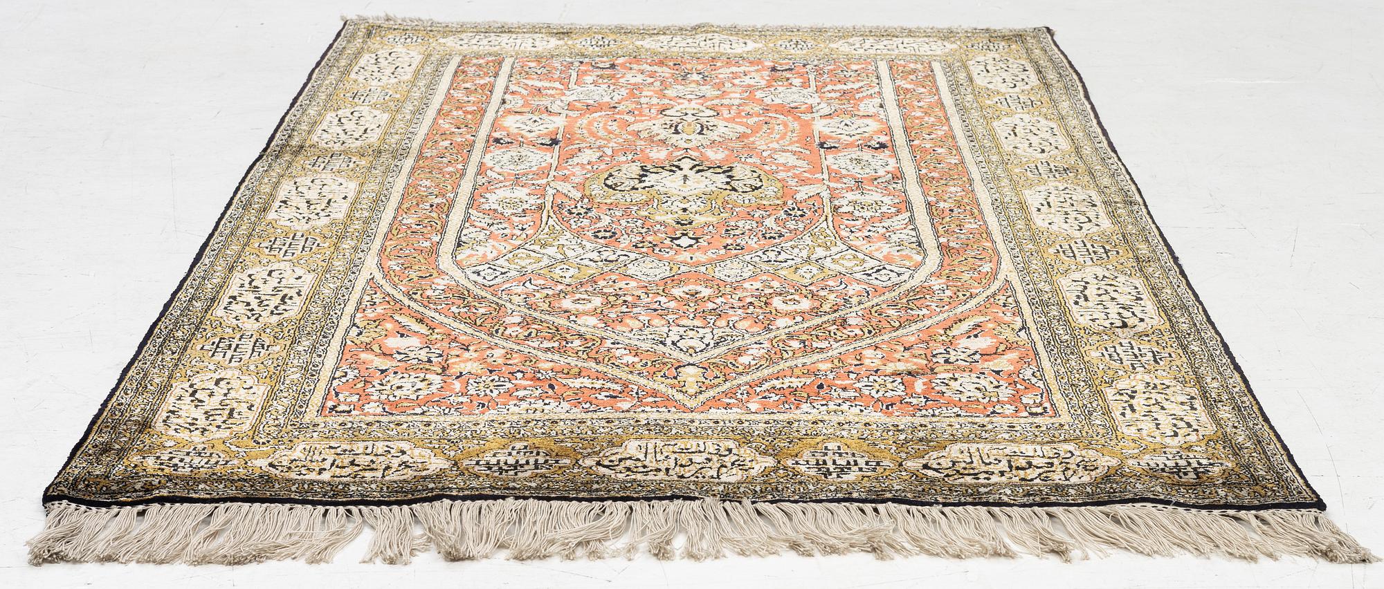 A silk Qum rug, c. 172 x 105 cm.