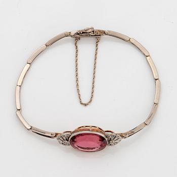 An 18K gold bracelet set with a faceted pink tourmaline weight ca 6.00 cts.