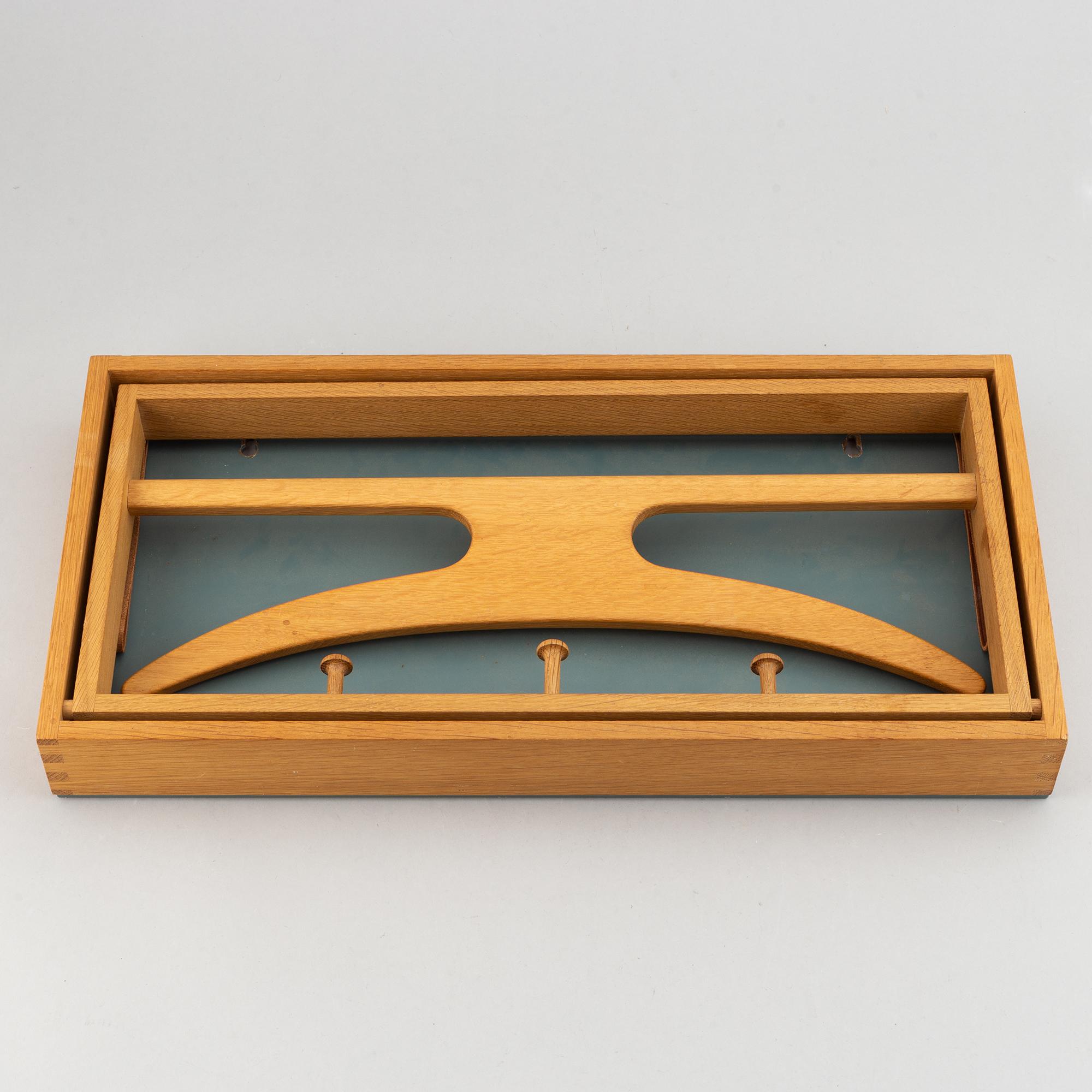 A clothes hanger by Adam Hoff & Poul Östergaard, Virum Möbelsnickeri, Denmark, mid 20th.
