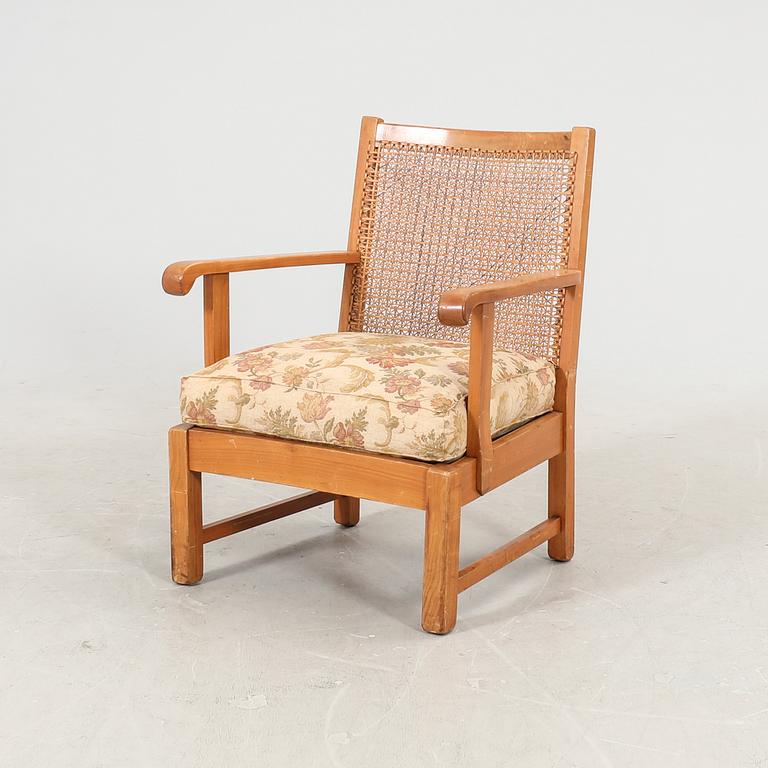 A 1940/50s rattan armchair.