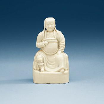 1428. A blanc de Chine figure of a dignitary, Qing dynasty, Kangxi (1662-1722).