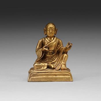 A small gilt-bronze seated Buddhist lama, Tibet, 20th Century.