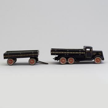 A mid 20th century toy truck, plate.