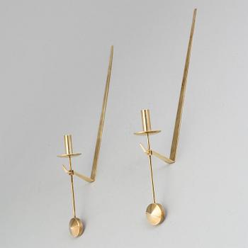 A pair of 20th century brass wall candleholders "Pendel" design Pierre Forssell for Skltuna, Sweden.