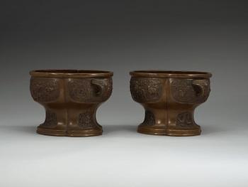 A pair of bronze flower pots, Qing dynasty, with Xuande six character mark to the interior.