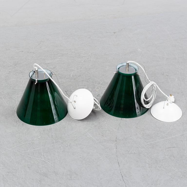 A pair of ceiling lamps in green and white glass, model no 4011, Zero.