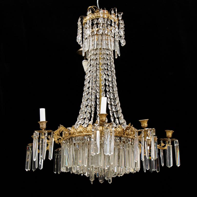 An Oscarian gilt brass eight-light chandelier.