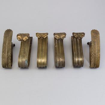 SIX BRONZE CURTAIN TIE-BACKS (4+2), 19th century.