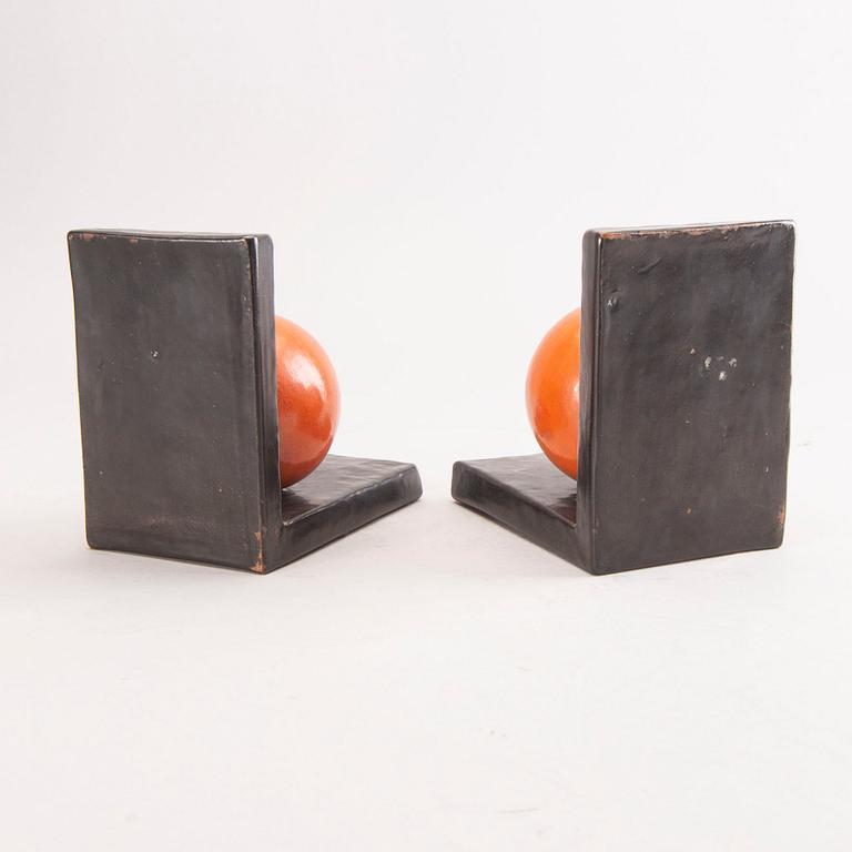 A pair of 1930s ceramic book stands.