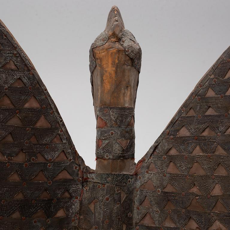 A sculpture, likely Ivory Coast, 20th century.