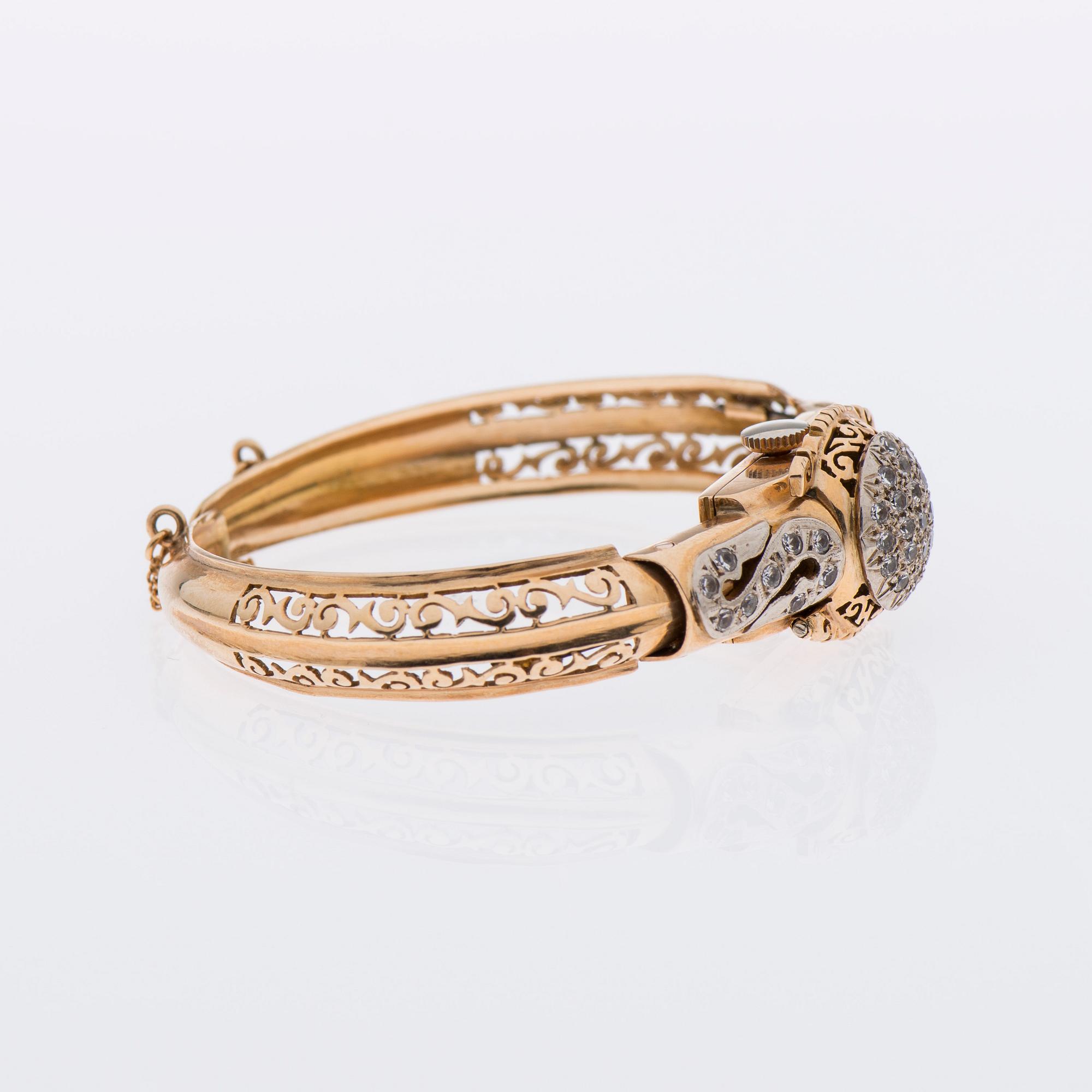 ARMBAND / ARMBANDSUR, 18K guld, åttkantslipade diamanter.