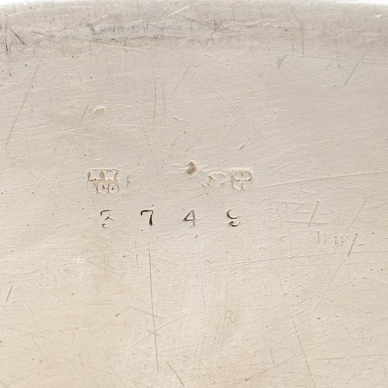 A set of four silver plated entree dishes, England.