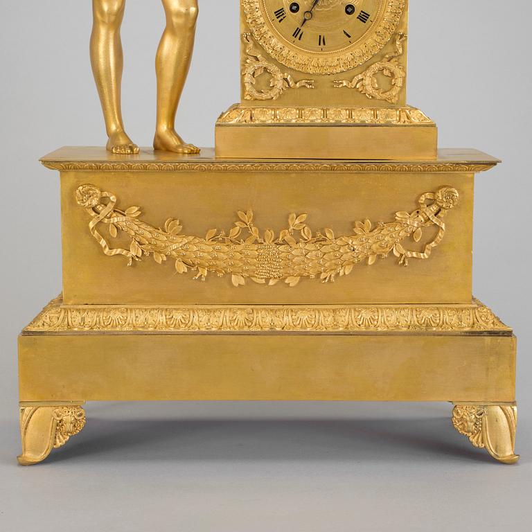 A French gilt bronze Empire mantle clock, early 19th Century.