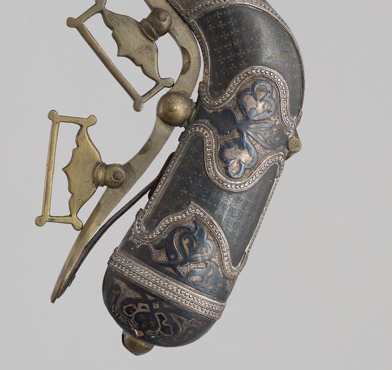 A Caucasian priming flask.