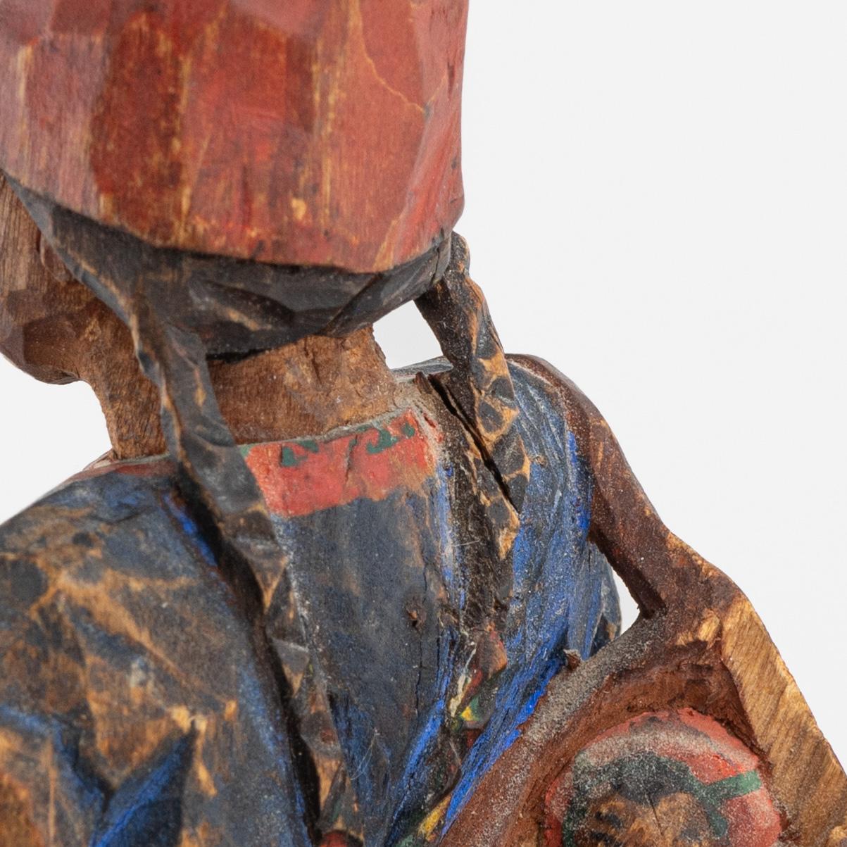 Torborg Lindberg-Karlsson, a pair of figurines, carved and painted wood, signed TL.