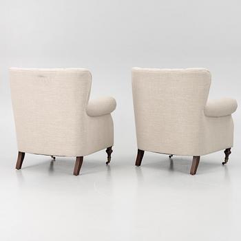 A pair of armchairs, early 21st century.