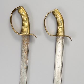 Two Swedish cutlasses 1846 pattern.