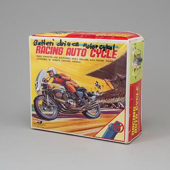 A 1970s battery operated toy racing auto cycle,Original "Junior" Product, Japan.