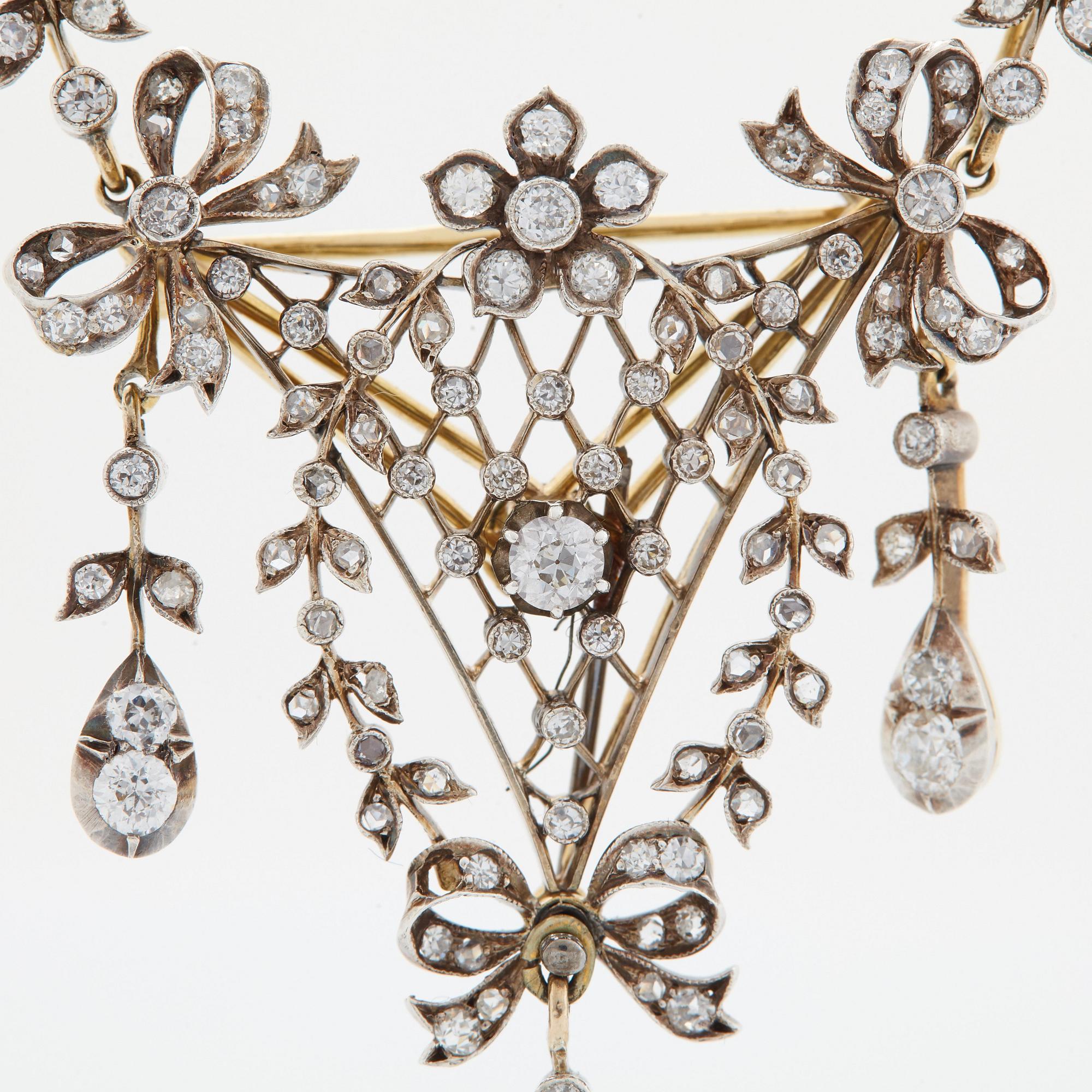 Brosch/hänge 14K guld och silver med gammal- och rosenslipade diamanter.