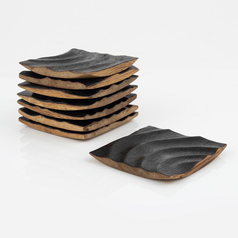 Magnus Ek, a set of eight oak plates for Oaxen Krog.