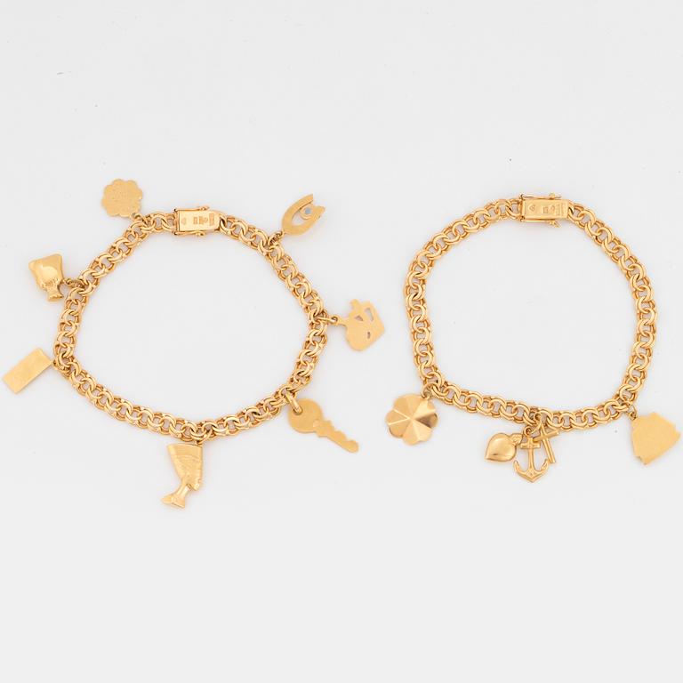 Two 18K gold bracelets, with charms.