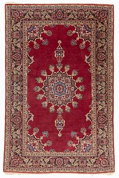An oriental rug, c. 205 x 133 cm.