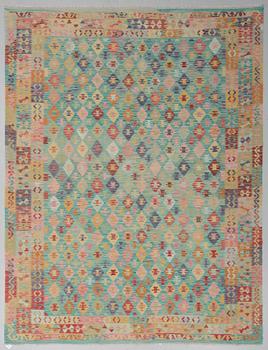 An oriental kilim, around 340 x 260 cm.