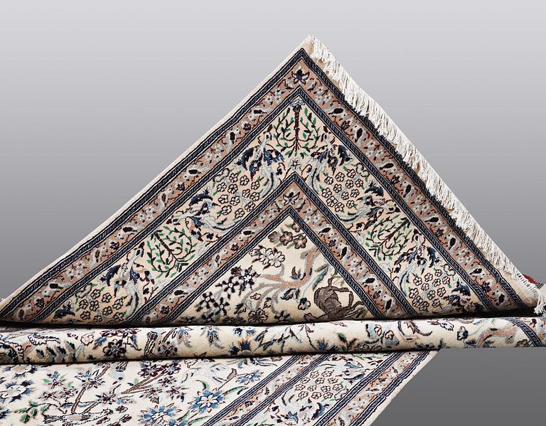 A CARPET, Nain, part silk, ca 302 x 192 cm.