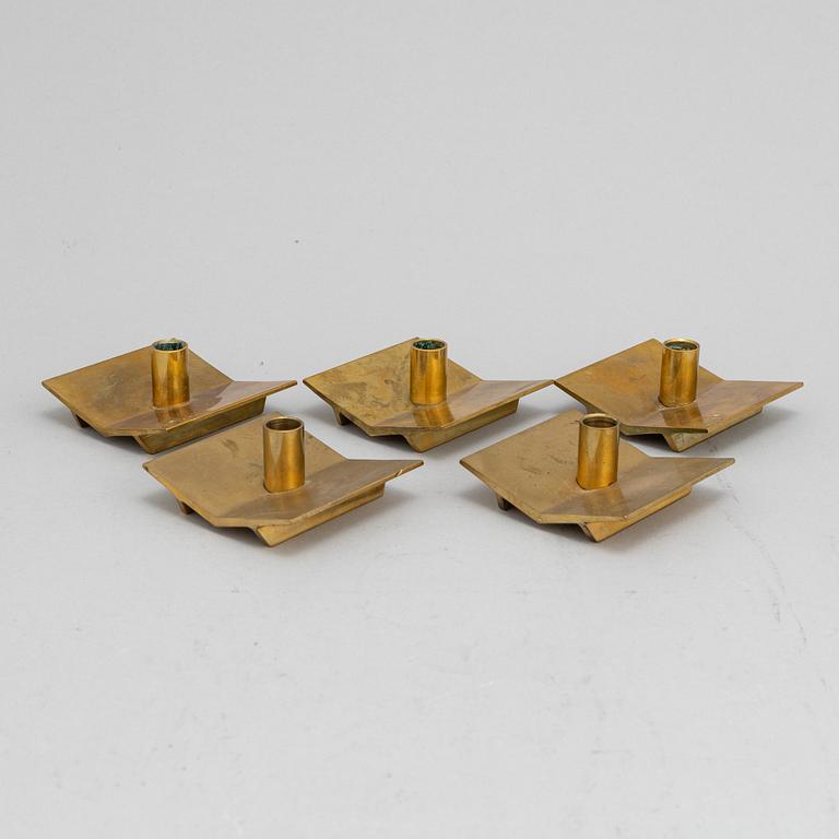 Pierre Forssell, a set of five brass 'Profil' candlesticks from Skultuna.