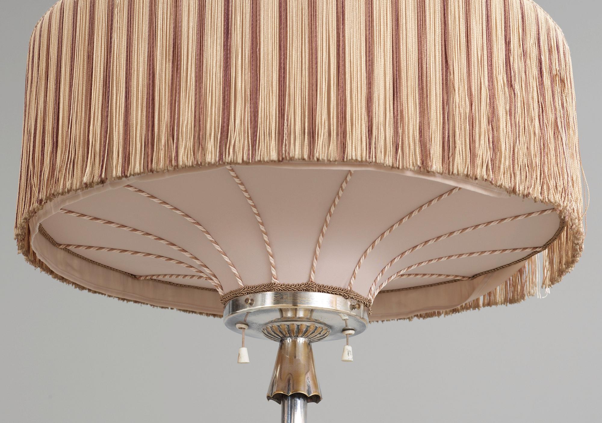 An Elis Bergh silver plated floor lamp by C.G. Hallberg, Stockholm ca 1925.